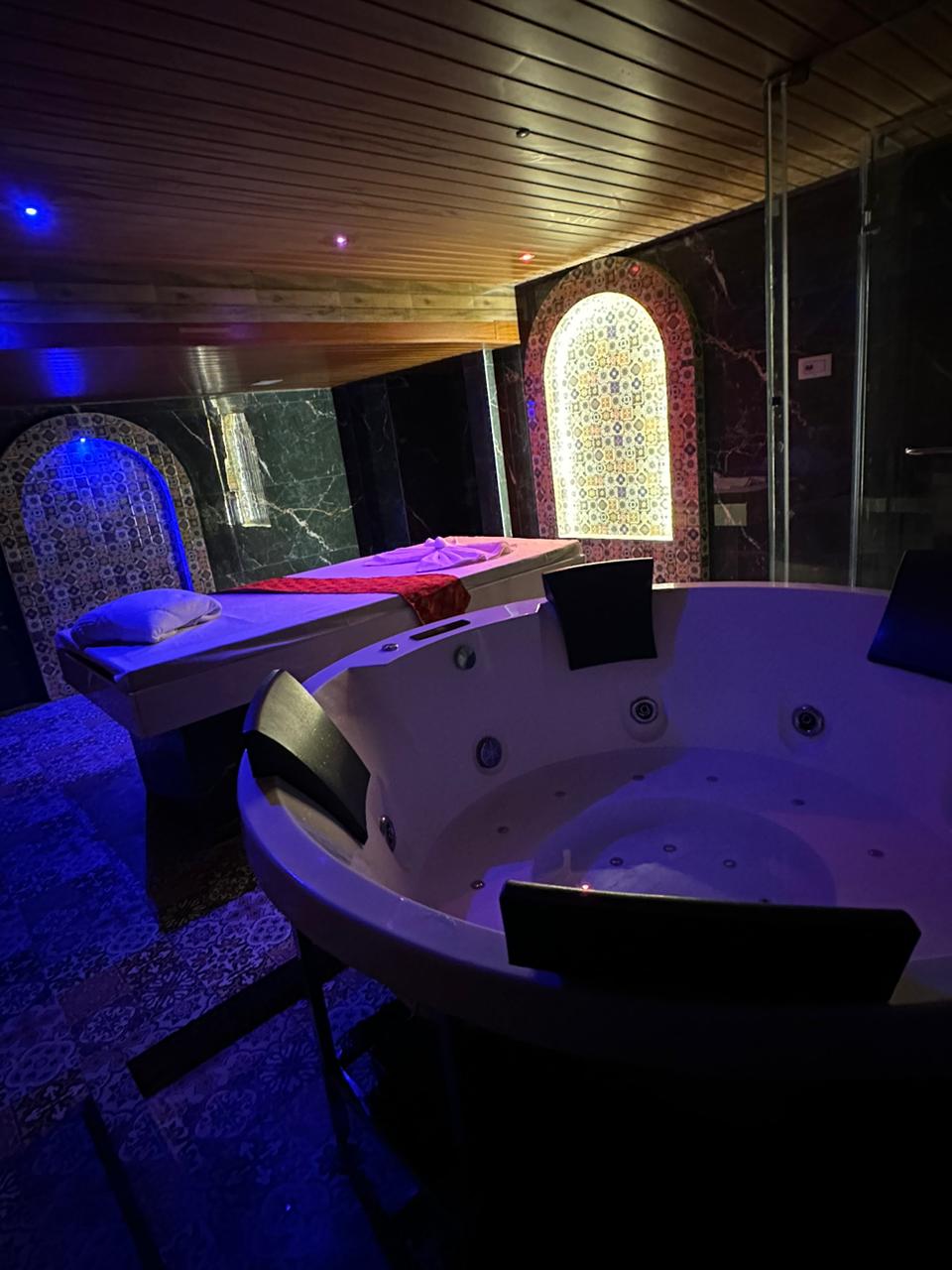 Modern spa room at YET International Spa with soft lighting and comfortable massage tables