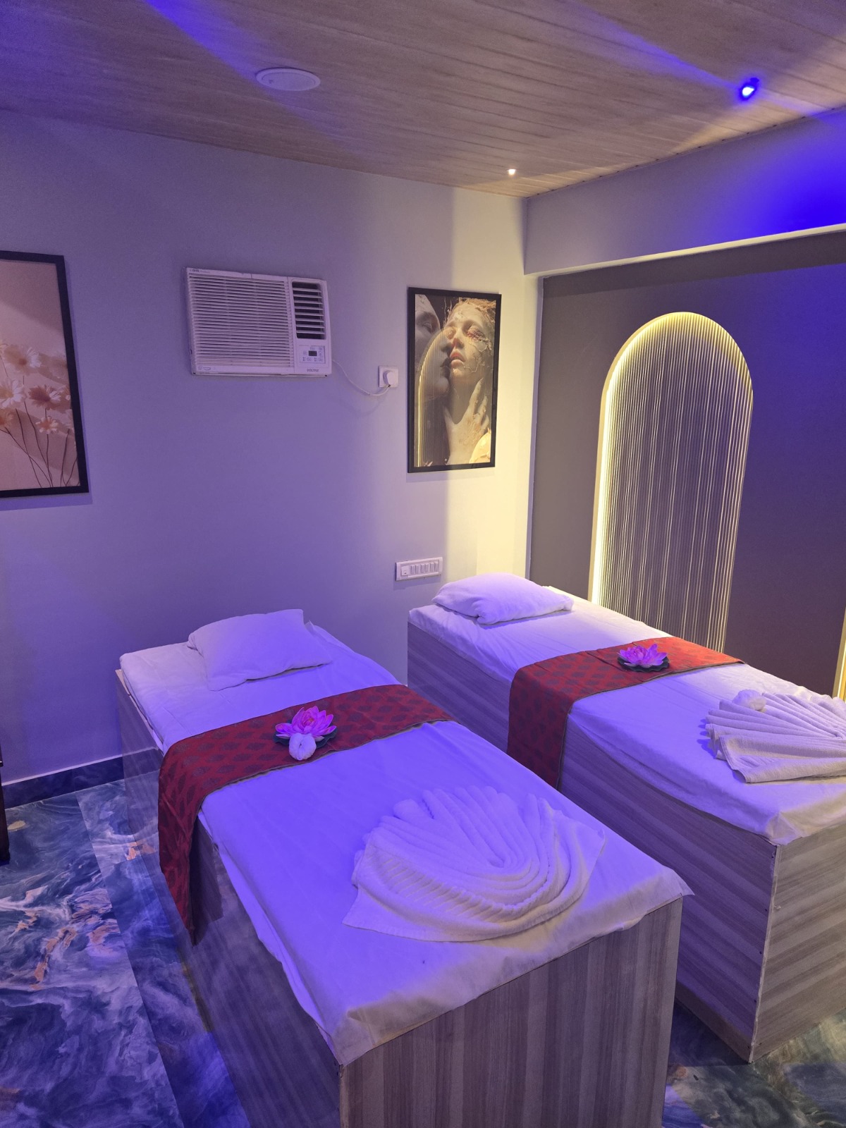 Modern spa room at YET International Spa with soft lighting and comfortable massage tables