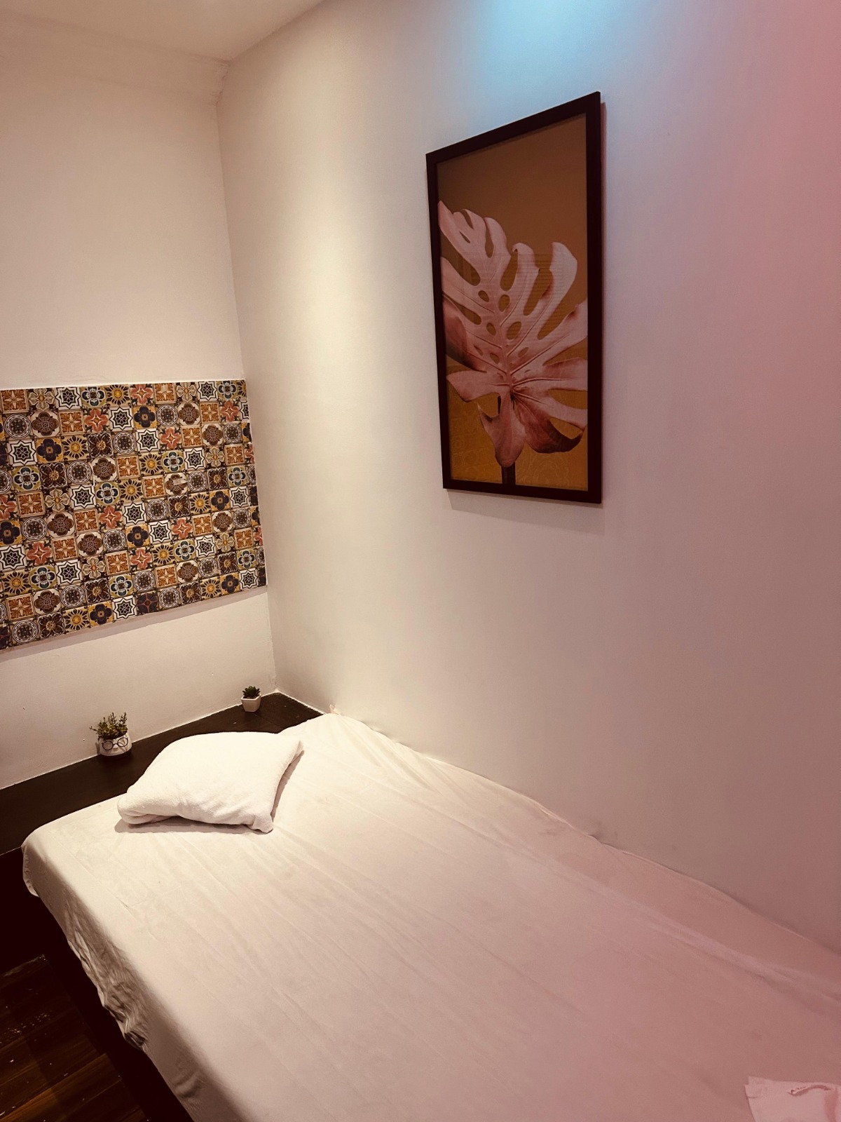 Modern spa room at YET International Spa with soft lighting and comfortable massage tables